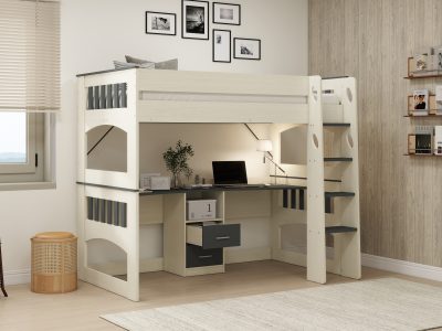 A detailed alt text description for the image is: "A modern, space-saving king single loft bunk bed in a bedroom, featuring a white and grey frame. The loft bed includes an integrated desk area underneath with drawers, a laptop, a lamp, and a plant. A ladder on the right side provides access to the elevated bed. On the left, a window with blinds is visible, and a round, woven stool sits near the bed frame. A tall, dark rack is positioned in the foreground on the left, and a wall-mounted shelving unit with books and decorative items is on the right."